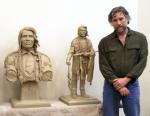 Sculptor Gareth Curtiss with clay models for Chief Bemidji statue